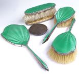 A George V Art Deco silver and green enamel 5-piece dressing table set, comprising hand mirror, 2