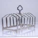 An Elizabeth II silver 7-bar toast rack, dome tops with carrying handle, by Adie Brothers, hallmarks