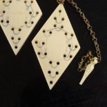 A pair of Victorian diamond-shaped whist markers, stamped patent, length 6cm