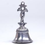 An 18th century Spanish cast-silver table bell, circa 1785, entwined dragon handle stamped Biosca,