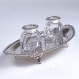 A George V silver desk stand, with 2 fitted silver-topped cut-glass inkwells and gadrooned rims,