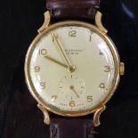 J W BENSON - a Vintage 9ct gold mechanical wristwatch, circa 1954, ref. 13851, silvered dial with