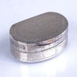 An early 19th century silver vinaigrette, semi-circular form with bright-cut engraved decoration,