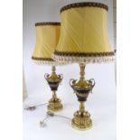 A pair of ornate brass 2-handled table lamps and shades, height excluding fittings 60cm, height