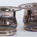 A pair of silver plate on copper wine coasters, with cast gadrooned borders, 18cm across