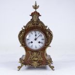 A late 19th century Rococo style walnut and brass 8-day mantel clock, white enamel dial with Roman