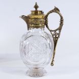 A good quality 19th century heavy cut-glass Claret jug, with cast gilt-bronze mount and hinged