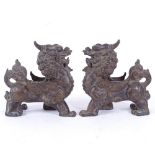 A pair of Chinese polished bronze Dogs of Fo, length 12cm