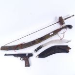 An Indian kukri knife, Italian Oklahoma target pistol, curved sword etc (4)