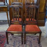 A set of 4 mahogany Arts and Crafts dining chairs with drop-in seats