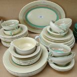 An Art Deco Susie Cooper Crown Works Burslem dinner service, including soup bowls, sauce boat,