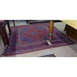A red ground Gazak rug, 118cm x 122cm