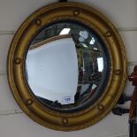 An early 20th century gilt-gesso circular convex wall mirror, overall diameter 34cm