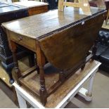 A large Antique oak gateleg table, with double-end frieze drawer, L115cm