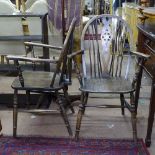 A pair of oak wheel-back elbow chairs