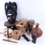 A carved ebony African head, 35cm, and 2 others, a painted gourd, a Tribal carved wood stool, toy