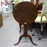 A small Georgian oak tilt-top table, on tripod base, W51cm