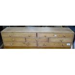 An Antique pine collector's chest of 7 drawers, with turned wood handles, length 56cm