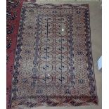 A red ground Tekke design rug, 155cm x 105cm