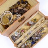 A leather jewel box with a quantity of mixed costume jewellery