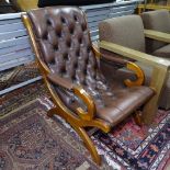 A mahogany-framed and buttoned-back brown leather upholstered slipper chair