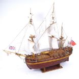 A handmade model of a 19th century Merchant ship, on stand, length 75cm, height 70cm