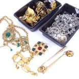 A tray of gold coloured costume jewellery, and silver coloured costume jewellery
