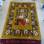 A 1970's design Ochre wool rug with figural design, 200cm x 145cm