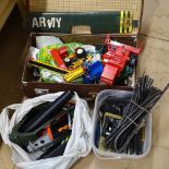 A suitcase of toys, including Britains, model railway items, aeroplane for reassembly etc