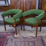 A pair of mid-century teak Danish design armchairs, with wrap around backs