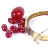 An 18ct gold stickpin, a Victorian ivory bangle, and a quantity of amber beads