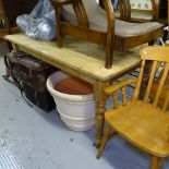 A rectangular pine kitchen table, on baluster legs, L150cm