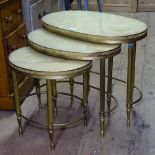 An oval nest of 3 occasional tables, with alabaster inset tops on gilt-metal bases