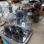 An Antique copper coal scuttle, pewter mugs and measures, a pair of decanters and stoppers, 33.5cm