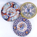 A Maiolica plate with portrait decoration, an Imari dish with design of vase of flowers on a