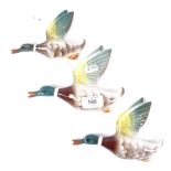 A graduated set of 3 Keele Street Pottery wall hanging flying ducks, largest length 19cm (3)
