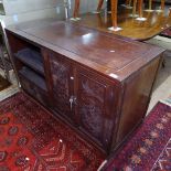 A Chinese hardwood design side cabinet, with relief carved panelled doors, on plinth base, W120cm,