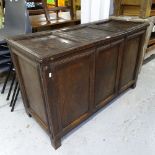 An 18th century joined oak cabinet, with panelled rising seat and cupboard doors under, on stile