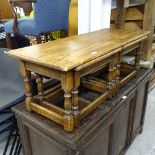 A rectangular oak nest of 3 occasional tables, W115cm