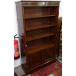 A mahogany and satinwood-banded open bookcase, with adjustable shelves and cupboards under, W92cm,