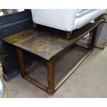 An Antique oak plank-top rectangular dining table, raised on canted legs and flat stretchers,