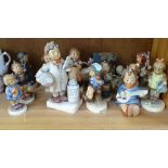 A collection of Hummel figures, tallest 14.5cm