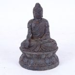 A small Chinese bronze seated Buddha, on double-lotus base, height 11cm
