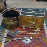 A Victorian brass coal bucket, a brass-clad magazine rack, fire irons etc