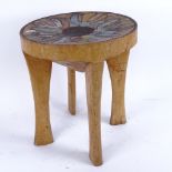 An African Kamba Tribal carved hardwood stool, inlaid with beads and wirework, seat diameter 30cm,