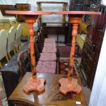 A pair of Oriental red lacquered circular stands, with painted and gilded decoration, W35cm, H73cm