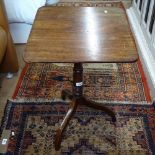 A small Georgian mahogany tilt-top table, on tripod base