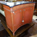 A Regency style concave painted side cabinet, with faux marble top, panelled doors, on carved