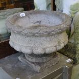 A pair of small weathered concrete garden urns, H32cm