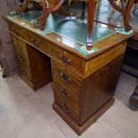 A small Edwardian mahogany twin-pedestal writing desk, with leather skiver and fitted drawers,